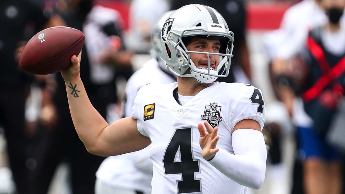 Las Vegas Raiders quarterback Derek Carr (4) passes the ball during the first half against the New England Patriots at Gillette Stadium.